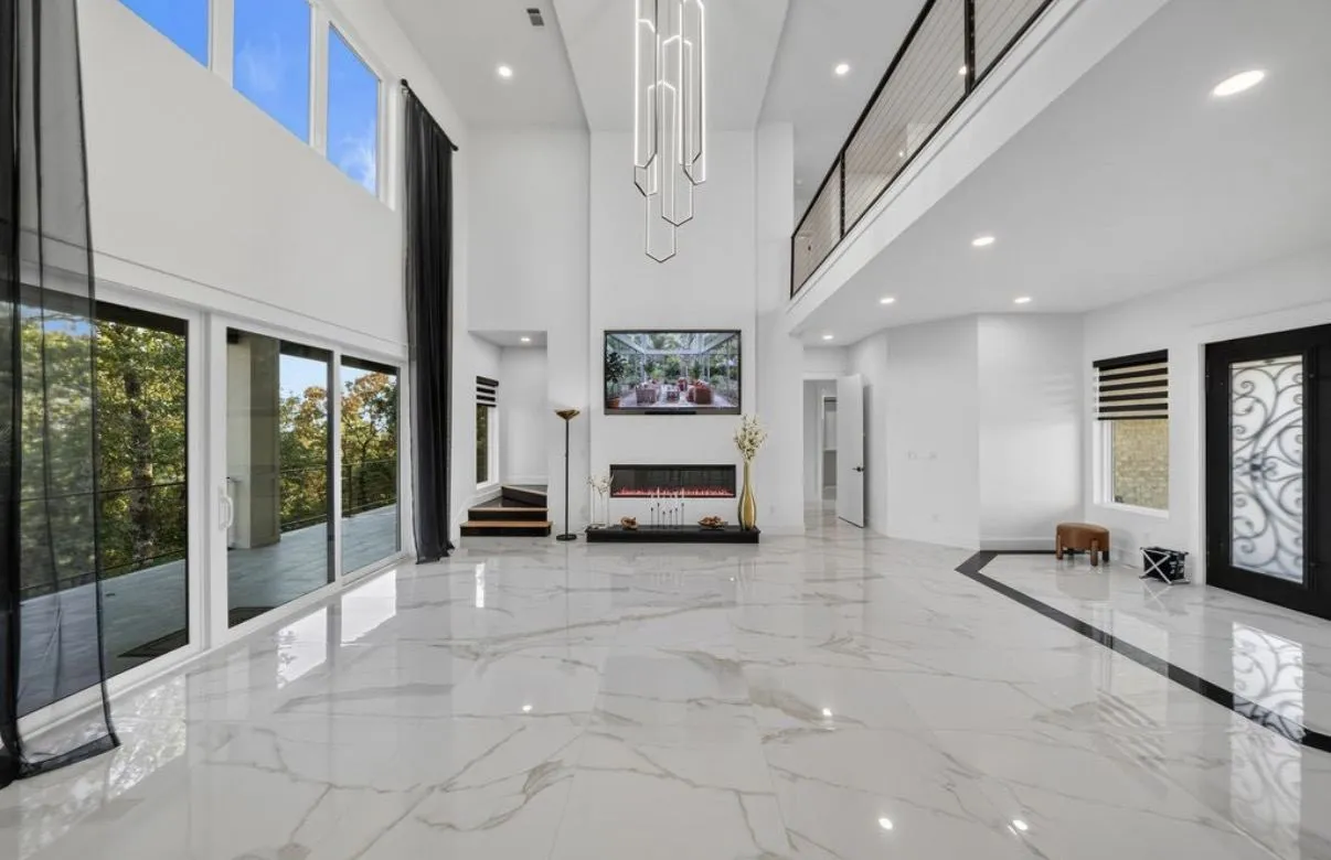 Great room with large-format marble-look porcelain floor